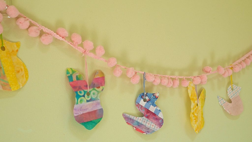 Easter Garland made with fabric created by using scraps and Mod Podge.  createwithclaudia - #easter #craft 