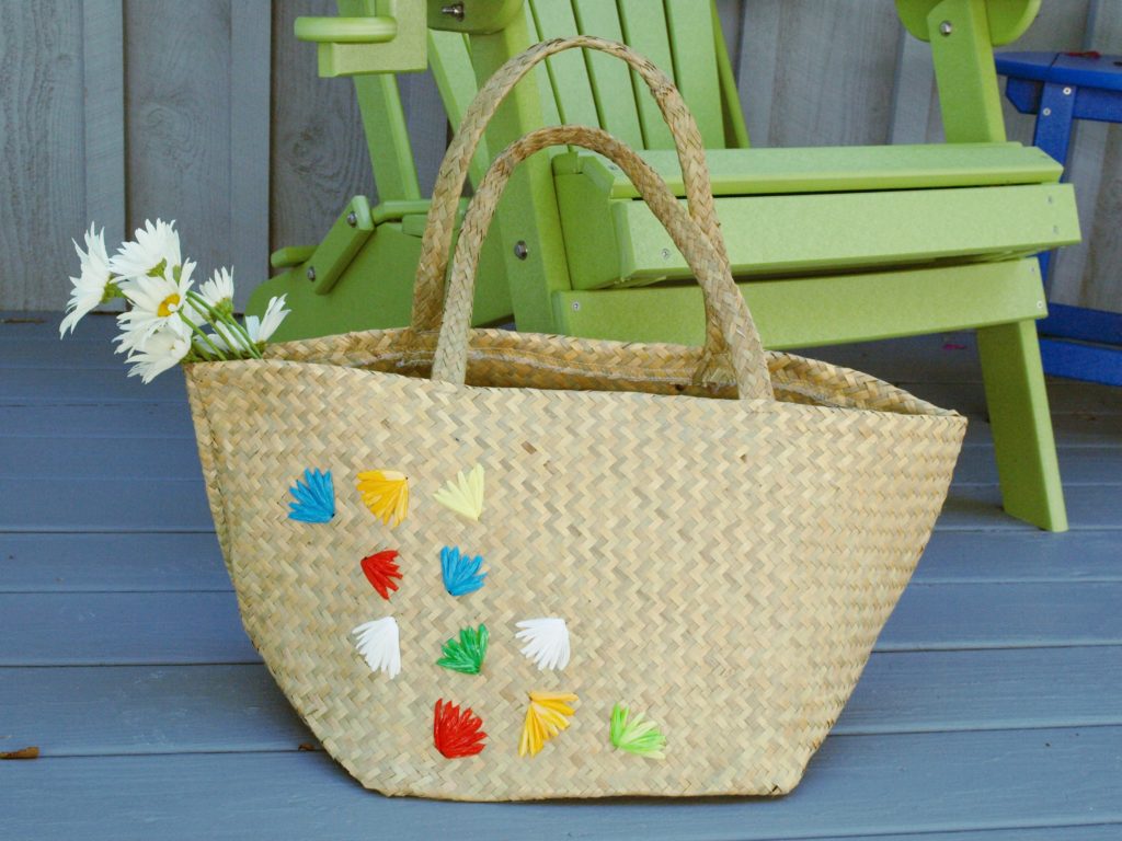 Learn how to embellish a straw tote with plastic bags using this easy DIY tutorial.