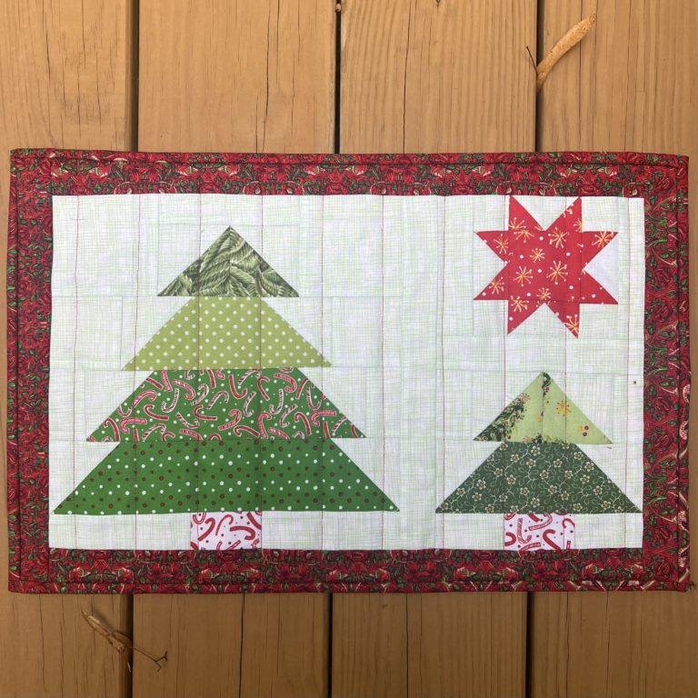 "Winter Trees” is a Free Christmas Quilted Placemat Pattern designed by Claudia from Create with Claudia!